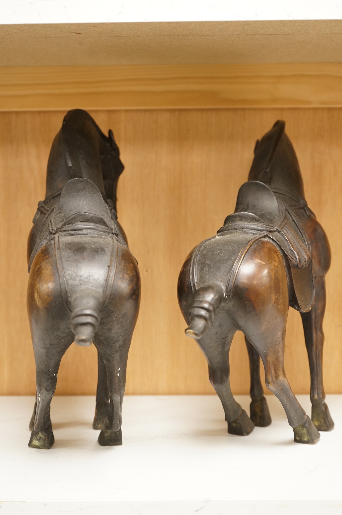 A pair of modern bronze figures of Tang horses, 30cm high